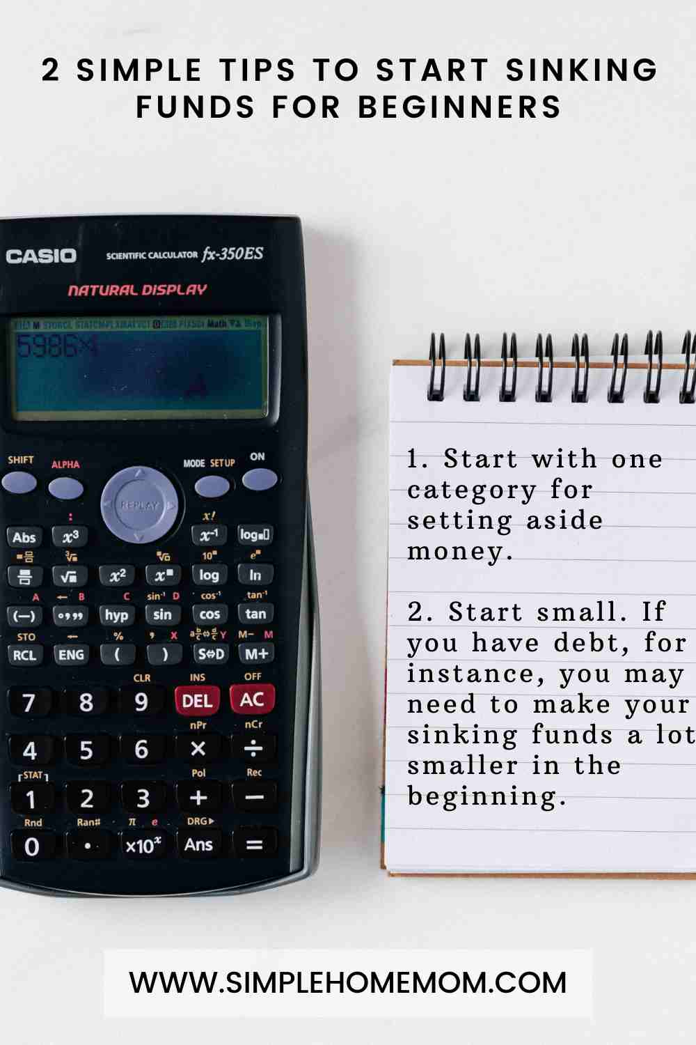 Calculator next to a notepad.