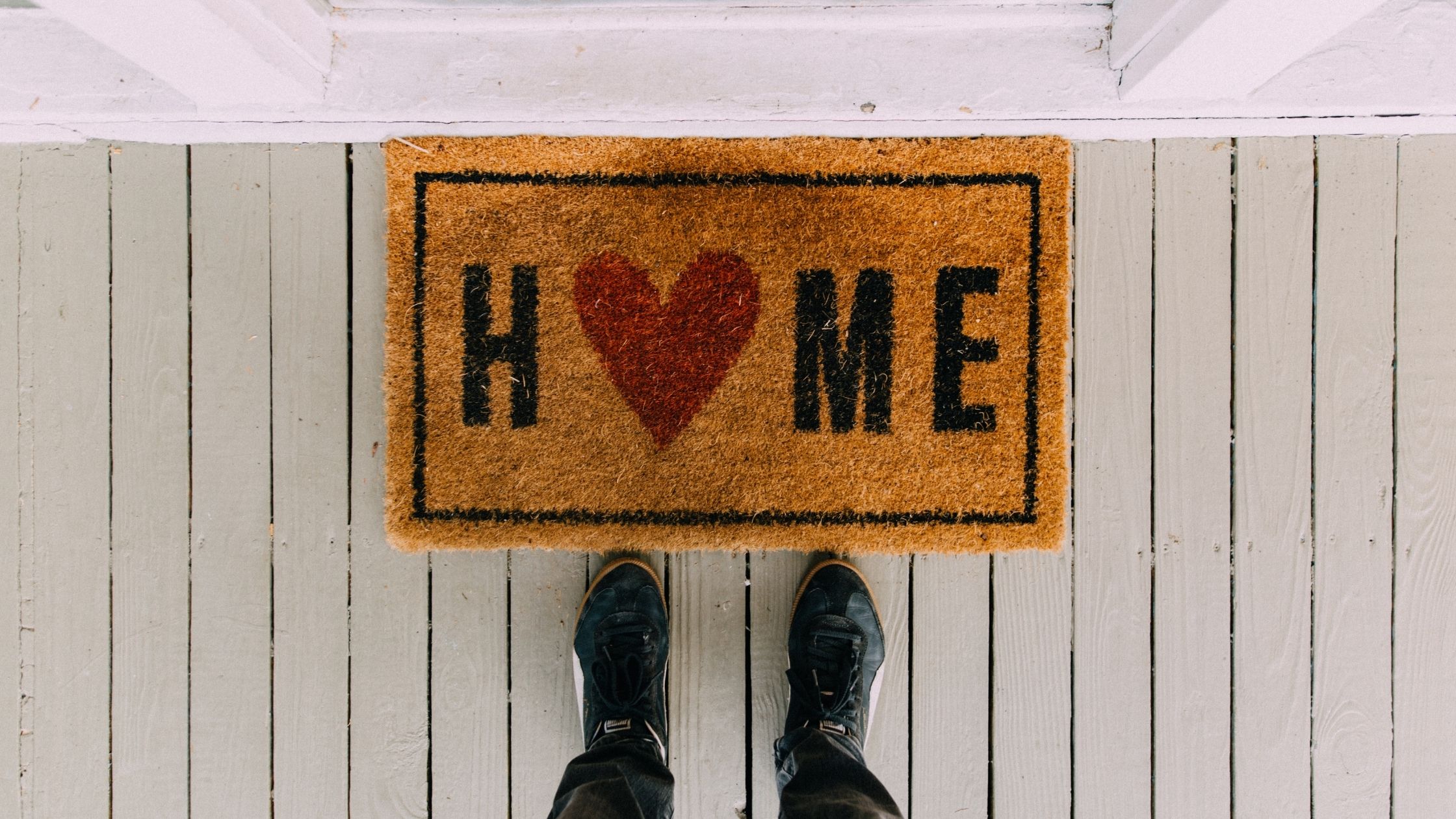 A home mat at the front door.