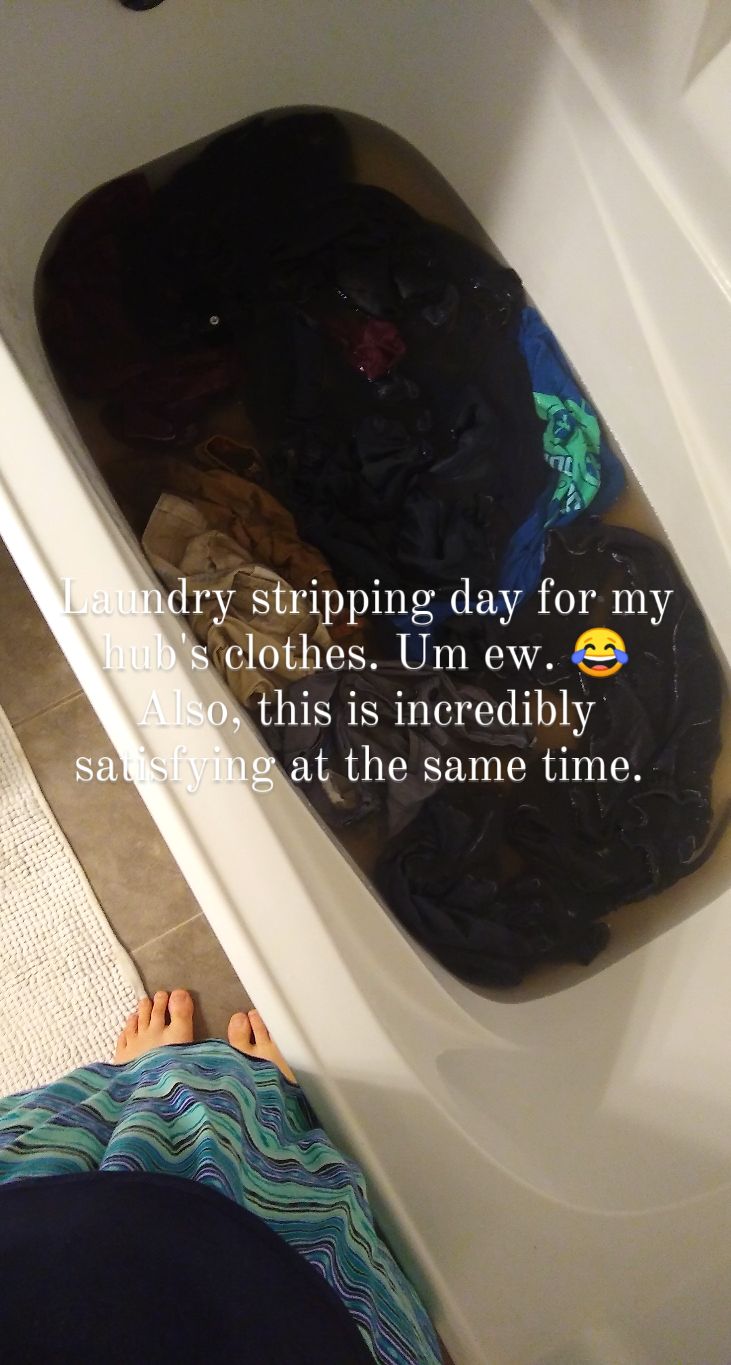 A picture of my hubby's clothes sitting in dark water in the tub.